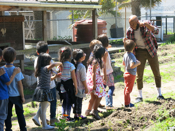 Photo of Jay teaching a gardening class